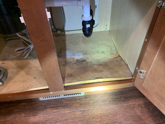 Damaged cabinet floor.