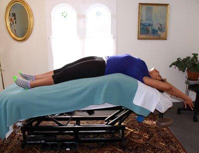 The Jim Craft massage table can extend back to effectively stretch out your core muscles.