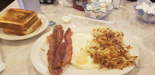 2 eggs, 4 bacon, toast and hash browns.