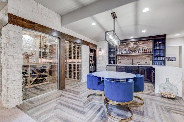 This Modern Farmhouse style basement remodel includes a wet bar, wine cellar, and more.