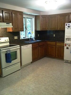 whole house renovation -- Granite tile counter top with mosaic back splash and Spectrum vinyl floor (Hebron NH)