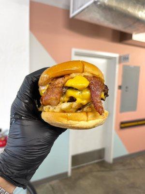 Our Fries Burger. Waffle fries, double angus beef, American cheese and Applewood's smoked bacon served on a warm potato bun.