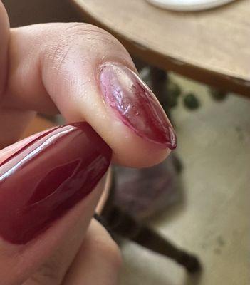 Not filled to the ends of the nails and shows the brush strokes not form correctly