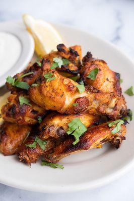 Flame Roasted Chicken Wings marinated in our special blend of spices and roasted in our brick ovens. (choice of mild, spicy or atomic)