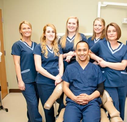 Some of our clinical staff pose in one of Nashua's bright treatment rooms.