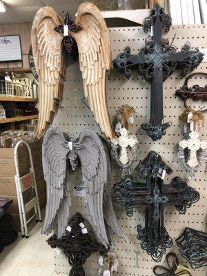 Metal angel wings and crosses.