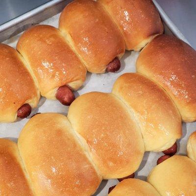 Fresh baked sausage and cheese kolaches with butter glazed