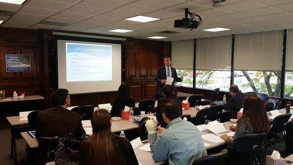 President Tom Marinaro teaching new hires during a new employee seminar.