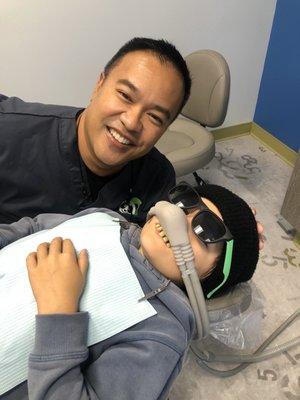 My son playing a practical joke on doctor with some Billy Bob teeth