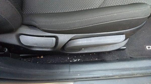 Dirt under passenger's seat