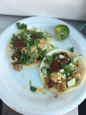 2 tacos pollos. Chicken. I added the cilantro and onions from the cold bar. $1 each and SO good!