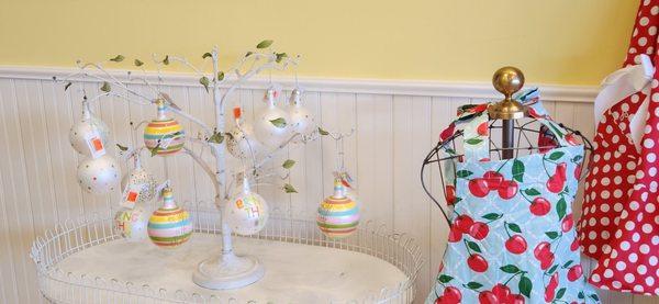 Hanging ornaments and colorful aprons.