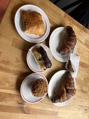 Assorted pastries. Scone, chocolate croissant, eclair, chocolate oatmeal cookie, banana nut muffin, croissant