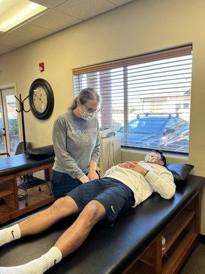 Hayley Poland PT, DPT works on her patients leg.