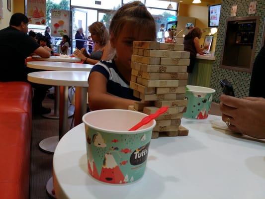 Playing Jenga while eating our yogurt