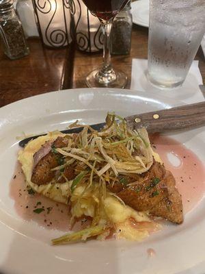 Duck breast over polenta with crispy leeks