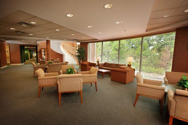 Lobby with chairs, couch, and coffee table