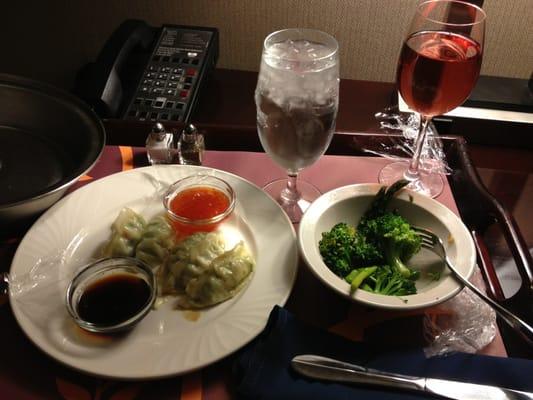 Room service from the grill, veggie potstickers and side if veggies and glass of wine ($37)