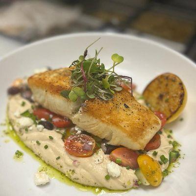 Pan seared halibut , roasted cauliflower puree , Mediterranean salad