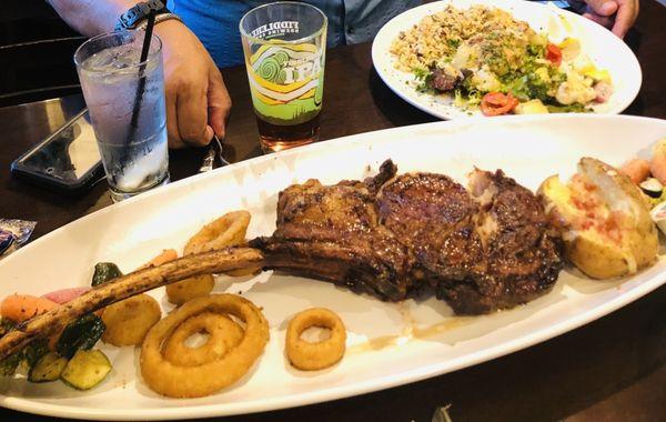 Tomahawk steak with onion rings and loaded baked potatoe - AMAZING