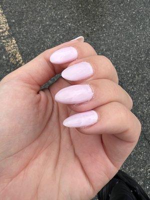 A "fresh" manicure with one gel extension that looks like the most absurd shape.