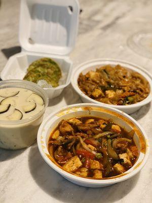 Clockwise from top left: Vegetable potstickers, drunken noodles w tofu, basil eggplant w tofu, and green curry w tofu