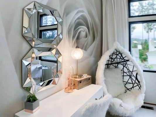 A fluffy hammock and white bedroom furniture simply resonate with beauty and comfort.