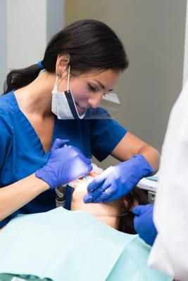 Dr. A Preece working with a patient.