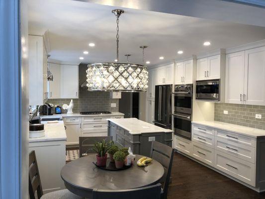 Complete kitchen remodeling service: A full line of kitchen cabinets, quartz countertops, backsplash tiles, hardwood floors, can lights, etc