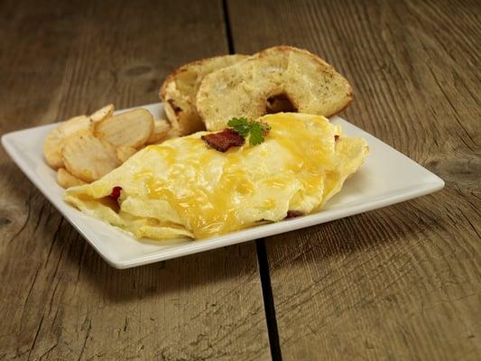 This delicious omelet is served with cottage fries and half of a toasted and buttered bagel. Delicious!