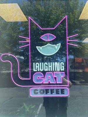 Neon sign of Laughing Cat Logo