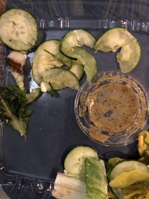 Slimy cucumbers and black lettuce top left.