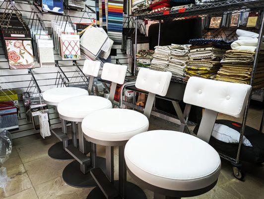 Set of 4 barstools transformed with this white vinyl for a kitchen island.