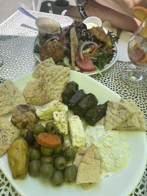 Salmon cakes over salad, and the mezede platter