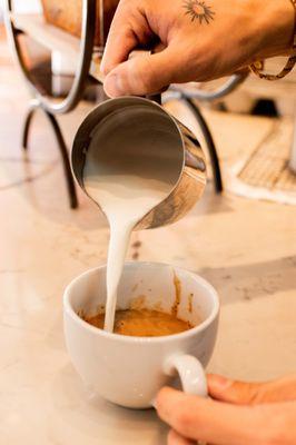 pouring a latte