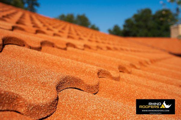 This stone coated metal roof has the beautiful look of terracotta tile with the benefits and durability of a metal roof.