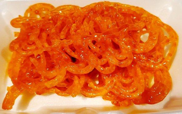 Hot fresh jalebi at the snack counter inside the grocery store