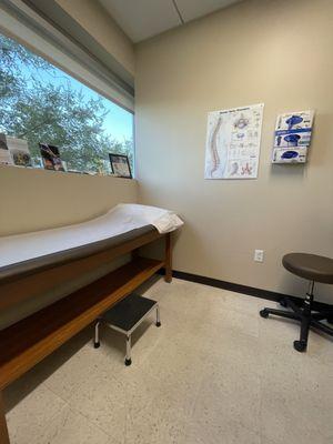 Exam room with natural light and spine diagram