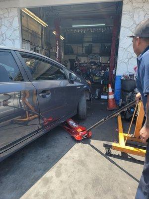 Lifting my car to see damage.