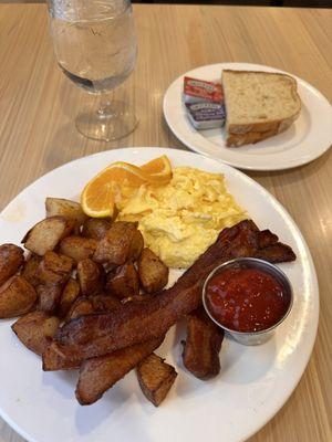 Sunrise basic breakfast. Bacon eggs potatoes and toast!