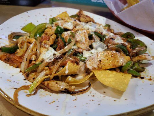 Grilled chicken nachos with grilled Jalapenos