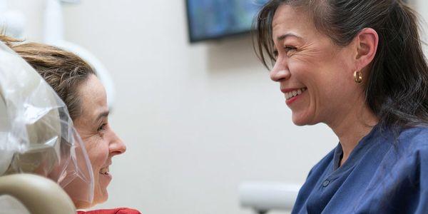 Dental hygienist with patient