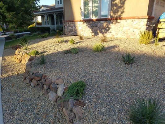 Padilla Group ripped out our lawn, leveled the slope a bit and added a small rockwall for us.