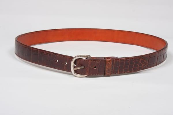 Alligator skin dress belt in chocolate color finish with fine sterling silver buckle.