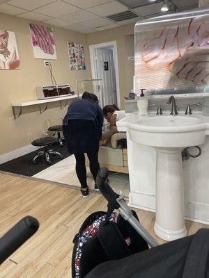 My daughter washing her hands in the pedicure bowl ... and the sink was RIGHT THERE!!!!