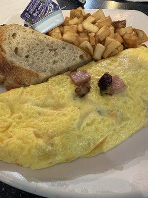 Ham and veggie omelette with sourdough toast and fried potatoes