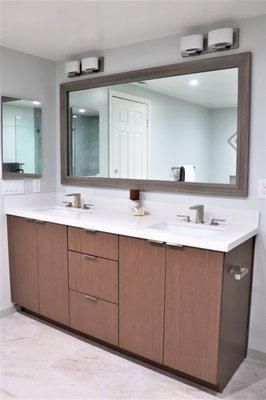 Modern wooden vanity with white countertops