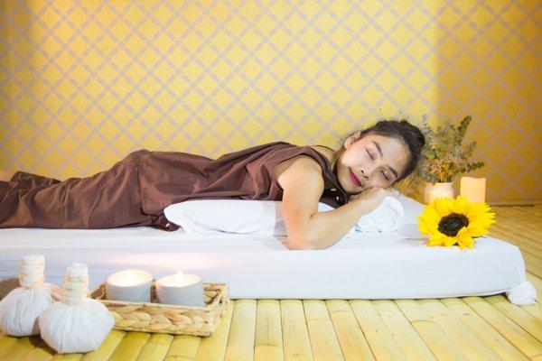 Traditional Thai Massage on a bamboo mat