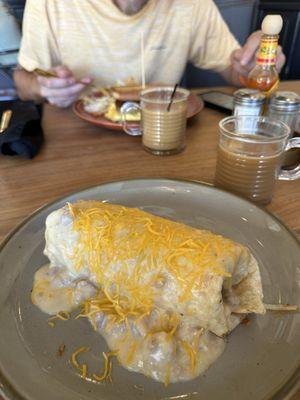 Bacon breakfast burrito with gravy.