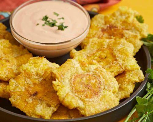 Tostones. Fried Plaintain lightly seasoned and served with MayoKetchu